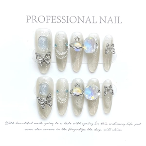 Handmade silver glitter press-on nails with 3D metal butterfly and planet charms