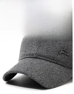 Macro shot of dark grey knit baseball cap with Sport metal logo and stiff brim detail