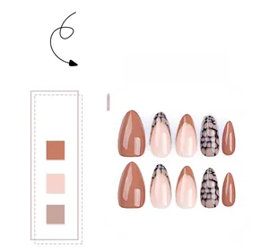 Set of 10 almond press-on nails featuring brown tones and golden line details