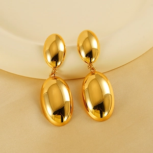 Polished 18K gold plated oval stud earrings on an elegant ceramic tray background