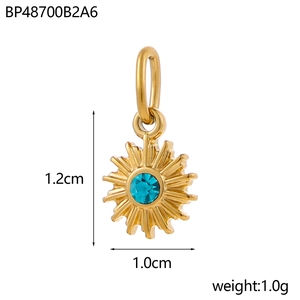 Detail of a golden sun pendant with a blue gemstone, sized 1.2cm by 1.0cm, weighing 1.0g