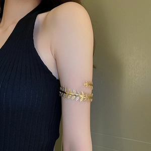 Golden leaf upper arm cuff with double-layer spiral design in Greek goddess style