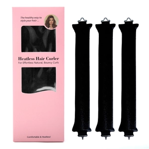 Detail view of pink heatless hair curler set box with three black sponge rollers