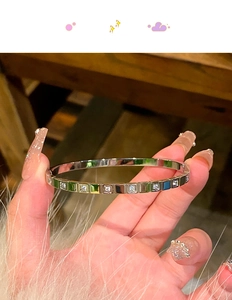 Detailed view of a silver square zircon titanium steel bracelet with a luxury finish