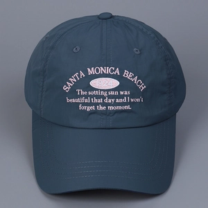 Detail of navy nylon baseball cap with pink embroidered Santa Monica Beach text