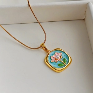 Vintage gold necklace with blue floral enamel square pendant and natural pearl detail