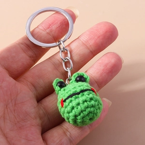 Handmade crochet green frog keychain with metal ring and soft cotton yarn texture