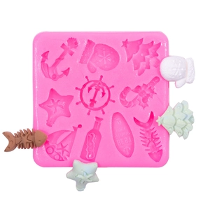 Pink silicone mold with Christmas and nautical shapes for DIY chocolate and fondant
