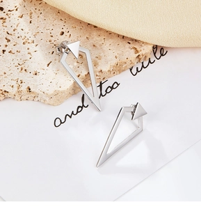 Macro shot of minimalist S925 sterling silver triangle stud earrings with polished finish
