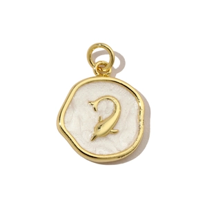 Macro view of gold dolphin pendant with white pearlescent enamel finish and metal ring