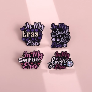 Set of four Taylor Swift inspired enamel pins with Swiftie Lover and Eras era designs