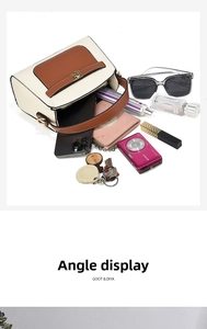 Top view of color-block crossbody bag showing spacious interior with personal essentials