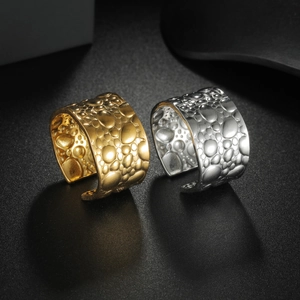 Minimalist geometric stainless steel rings in gold and silver with textured surface