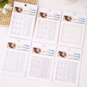 Detailed set of self-adhesive 3D nail art stickers with pearls, hearts, and rhinestones