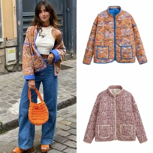 Detail view of vintage floral quilted jackets in orange-blue and dark red patterns