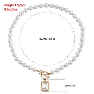 Elegant pearl necklace with golden toggle clasp and sparkling rectangle crystal pendant