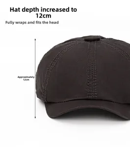 Detail of dark coffee cotton newsboy cap showing the 12cm deep fit and side stitching