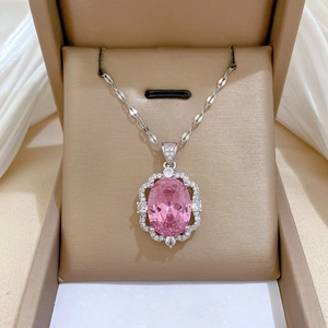 Close-up of luxury pink oval gemstone pendant necklace in a premium jewelry gift box