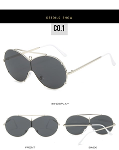 Three-way view of oversized gold frame sunglasses with dark grey one-piece lens