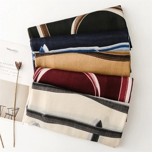 Flat lay of geometric pattern linen-feel scarves in various autumn colors and French style