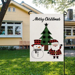 Christmas garden flag featuring Santa and snowman with red plaid on a yard pole