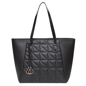 Women's black tote bag with geometric quilting and golden ring charms on white background