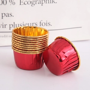 Close-up of red and gold metallic foil cupcake liners for heat-resistant baking