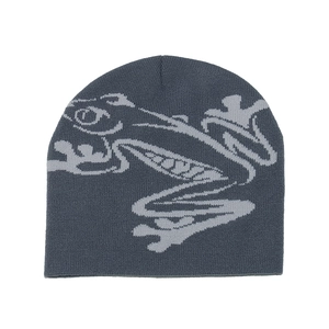 Close-up of gray beanie showing detailed knit texture and abstract jacquard pattern