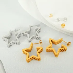 Star shaped hollow steel hoop earrings in gold and silver with textured gear edges