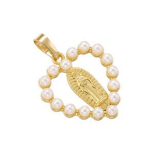 Close-up of golden heart pendant with pearl inlay and religious Madonna relief detail