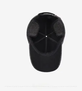 Detail of winter baseball cap with thick warm lining and foldable ear flaps for cold weather
