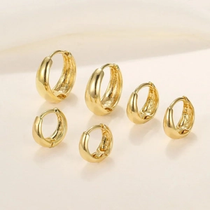 Three pairs of elegant gold hoop earrings in small, medium, and large sizes