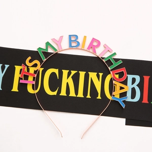 Detailed view of metal headband with colorful It's My Birthday lettering for parties