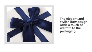 Detail of white textured jewelry box with an elegant navy blue satin ribbon bow