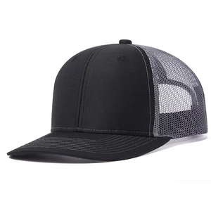 Detailed side view of black and gray trucker hat with breathable mesh and structured crown