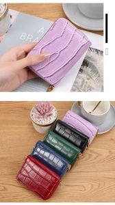 Close-up of crocodile pattern PU leather mini wallets in five elegant colors with zippers