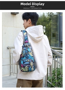 Detail of crossbody bag with tropical leaf print and functional mesh side pocket