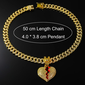 Detail of gold Cuban chain with iced out broken heart pendant and size measurements