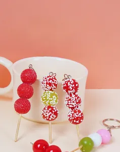 Macro shot of miniature simulation sugar gourd food charms for DIY keychain crafts