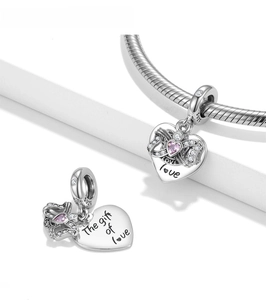 Detailed view of S925 silver heart charm with Love engraving and pink gemstone inlay