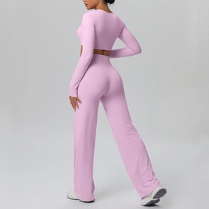 Detail of high waist wide leg pants and cropped top in pink breathable yoga set