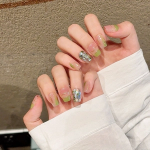 Fresh green and pink press-on nails with gold thread and sparkling rhinestones