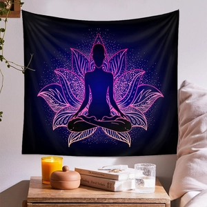 Detail of meditation tapestry with glowing lotus and yoga silhouette in a cozy room