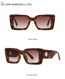 Macro detail of rectangle sunglasses with yellow tortoise frame and gold metal side accents
