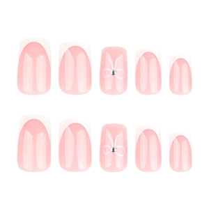 French tip press-on nails in pink jelly base with white bows and tiny rhinestones