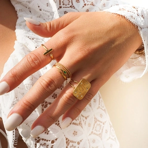 Set of gold-plated stainless steel rings with snake design and emerald zircon accents