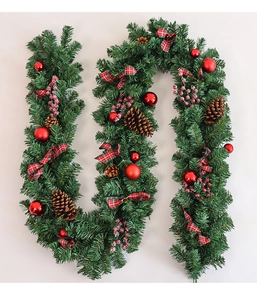 Close-up of 2.7m Christmas garland with pine needles, red berries, cones and plaid bows