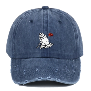 Distressed wash denim baseball cap featuring white prayer hands and red rose embroidery