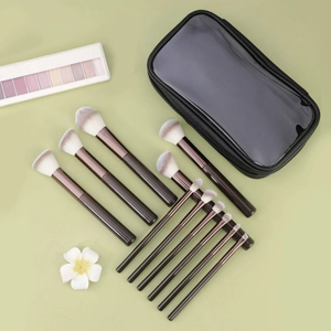 11-piece wooden makeup brush set with gradient bristles and a clear-window zip pouch