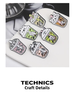 Detail of colorful enamel animal boba tea pins with pandas and rabbits in macro view